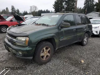 2003 Chevrolet TrailBlazer LTZ with VIN 1GNDT13S332336835, listed as a Copart auction lot 87223954 with 154,435 mi miles and Salvage Title. Bid and sale history available at DreamBid. Image 1.