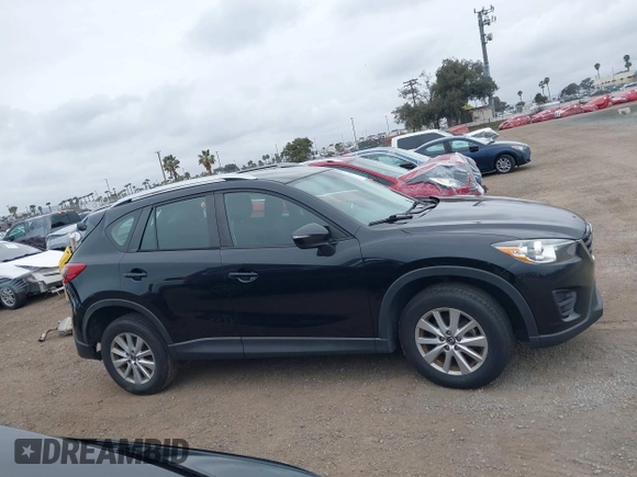 2016 Mazda CX-5 Sport with VIN JM3KE2BY4G0761933, listed as a IAAI auction lot 41709274 with 131,127 mi miles. Bid and sale history available at carsss.com. Image 14.