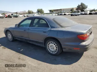 1997 Mazda Millenia z VIN JM1TA2213V1308406, wystawiony jako Copart lot #74141674 z przebiegiem 205 115 mil mil oraz Tytuł czysty. Historia ofert i sprzedaży dostępna na DreamBid. Obrazek 2.