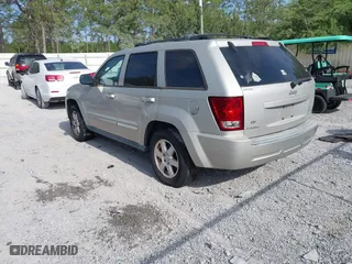 2010 Jeep Grand Cherokee Laredo with VIN 1J4PS4GK6AC136702, listed as a IAAI auction lot 42066484 with 126,509 mi miles. Bid and sale history available at carsss.com. Image 3.