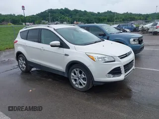 2016 Ford Escape Titanium with VIN 1FMCU9JX4GUB72080, listed as a IAAI auction lot 42519240 with 121,793 mi miles and . Bid and sale history available at DreamBid. Image 1.