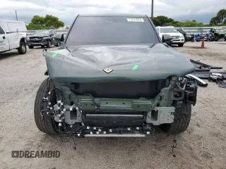 2023 Rivian R1T Adventure z VIN 7FCTGAAA8PN001040, wystawiony jako Copart lot #71517874 z przebiegiem 19 789 mil mil oraz Szkody całkowita. Historia ofert i sprzedaży dostępna na DreamBid. Obrazek 5.