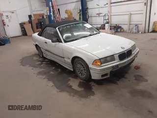 1997 BMW 3-Series 328IC with VIN WBABK832XVET95942, listed as a IAAI auction lot 41246303 with 165,825 mi miles. Bid and sale history available at carsss.com. Image 1.