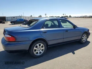 2002 Mazda 626 LX with VIN 1YVGF22C825293243, listed as a Copart auction lot 61084684 with 217,339 mi miles and Salvage Title. Bid and sale history available at carsss.com. Image 3.