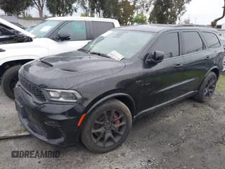 2023 Dodge Durango SRT 392 Premium with VIN 1C4SDJGJ6PC557943, listed as a IAAI auction lot 41478480 with 13,733 mi miles and . Bid and sale history available at DreamBid. Image 2.