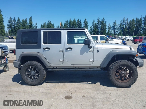 2008 Jeep Wrangler Unlimited X with VIN 1J4GA39148L596727, listed as a IAAI auction lot 42632457 with 175,000 mi miles and . Bid and sale history available at DreamBid. Image 13.
