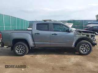 2022 GMC Canyon 4WD AT4 z VIN 1GTG6FEN2N1101756, wystawiony jako IAAI lot #42107148 z przebiegiem 37 900 mil mil oraz . Historia ofert i sprzedaży dostępna na DreamBid. Obrazek 14.