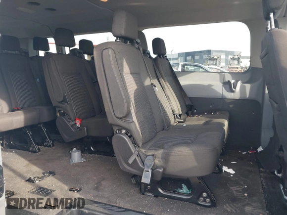 2018 Ford Transit Passenger XL with VIN 1FBZX2YM0JKA70128, listed as a IAAI auction lot 42379000 with 125,309 mi miles and . Bid and sale history available at DreamBid. Image 8.