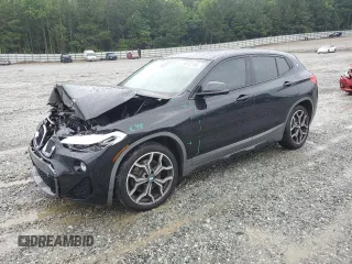 2018 BMW X2 sDrive28i with VIN WBXYJ3C32JEJ82802, listed as a Copart auction lot 58702155 with 72,694 mi miles and Salvage title. Bid and sale history available at DreamBid. Image 1.
