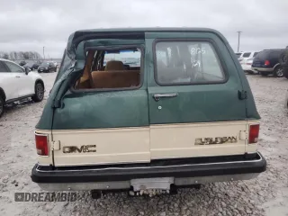 1990 GMC Suburban z VIN 1GKGR26K8LF528125, wystawiony jako Copart lot #84931724 z przebiegiem Nie podano mil oraz Szkody całkowita. Historia ofert i sprzedaży dostępna na DreamBid. Obrazek 6.