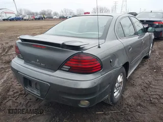 2004 Pontiac Grand Am SE with VIN 1G2NE52FX4M674634, listed as a IAAI auction lot 41547421 with 125,225 mi miles. Bid and sale history available at carsss.com. Image 4.