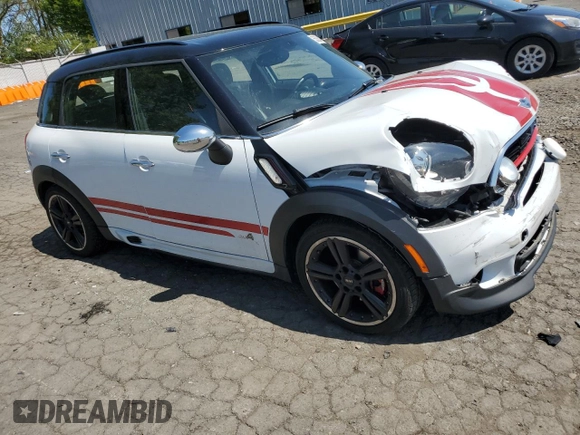 2015 MINI Countryman John Cooper Works with VIN WMWXD1C58FWS34860, listed as a Copart auction lot 55384065 with 48,709 mi miles and Salvage Title. Bid and sale history available at DreamBid. Image 4.
