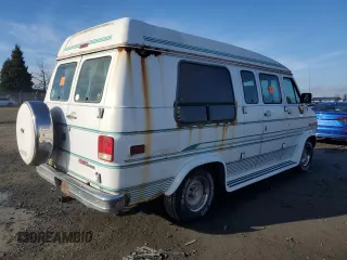 1995 GMC Vandura z VIN 1GDEG25K1SF505970, wystawiony jako Copart lot #87524905 z przebiegiem 130 163 mil mil oraz Tytuł czysty. Historia ofert i sprzedaży dostępna na DreamBid. Obrazek 3.