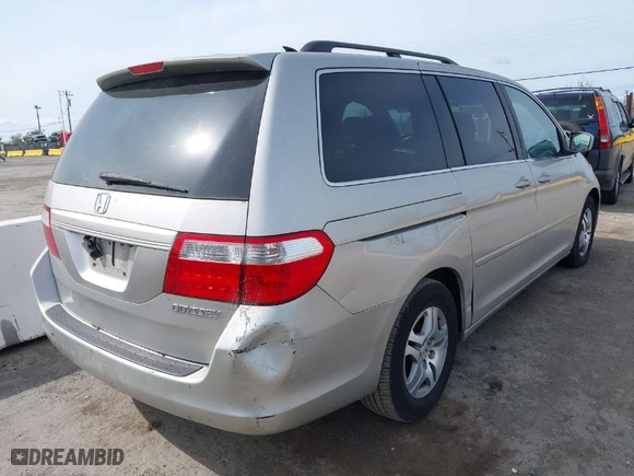2005 Honda Odyssey EX-L with VIN 5FNRL38745B126338, listed as a IAAI auction lot 41991119 with 165,552 mi miles. Bid and sale history available at carsss.com. Image 4.