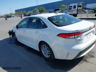 2021 Toyota Corolla Hybrid LE with VIN JTDEAMDE6MJ032371, listed as a IAAI auction lot 42086942 with 68,335 mi miles. Bid and sale history available at carsss.com. Image 3.