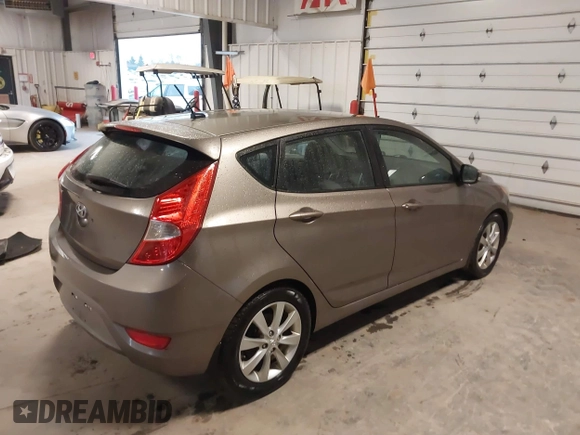 2013 Hyundai Accent SE with VIN KMHCU5AE6DU097353, listed as a IAAI auction lot 41937225 with 173,447 mi miles. Bid and sale history available at carsss.com. Image 4.