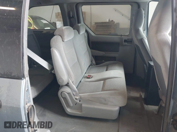 2005 Ford Freestar S z VIN 2FMZA50685BA79604, wystawiony jako IAAI lot #42378859 z przebiegiem 195 532 mil mil oraz . Historia ofert i sprzedaży dostępna na DreamBid. Obrazek 8.