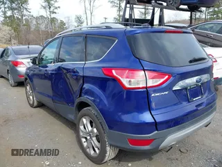 2016 Ford Escape Titanium with VIN 1FMCU9JXXGUA71898, listed as a IAAI auction lot 41758284 with 51,935 mi miles. Bid and sale history available at carsss.com. Image 3.