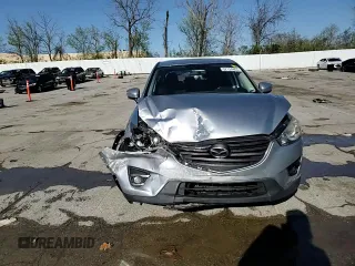 2016 Mazda CX-5 Touring with VIN JM3KE2CY8G0614335, listed as a Copart auction lot 52124465 with 218,320 mi miles and Salvage Title. Bid and sale history available at carsss.com. Image 12.
