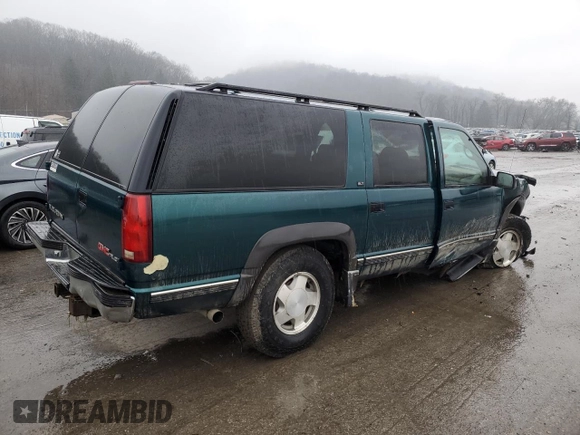 1995 GMC Suburban z VIN 1GKFK16K0SJ748087, wystawiony jako Copart lot #85121834 z przebiegiem 191 550 mil mil oraz Szkoda całkowita • Salvage title. Historia ofert i sprzedaży dostępna na DreamBid. Obrazek 3.