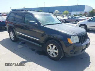2010 Jeep Grand Cherokee Laredo with VIN 1J4PR4GK2AC104857, listed as a IAAI auction lot 42009569 with 131,986 mi miles. Bid and sale history available at carsss.com. Image 1.
