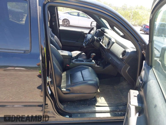 2019 Toyota Tacoma SR with VIN 5TFCZ5AN4KX208354, listed as a IAAI auction lot 42771410 with 77,509 mi miles and . Bid and sale history available at DreamBid. Image 5.