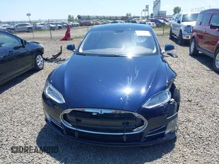 2014 Tesla Model S 60 with VIN 5YJSA1H18EFP31969, listed as a IAAI auction lot 42312485 with 90,043 mi miles and . Bid and sale history available at DreamBid. Image 13.