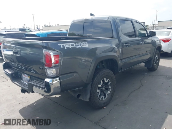 2023 Toyota Tacoma SR with VIN 3TMCZ5AN0PM635933, listed as a IAAI auction lot 42543126 with 32,960 mi miles and . Bid and sale history available at DreamBid. Image 4.
