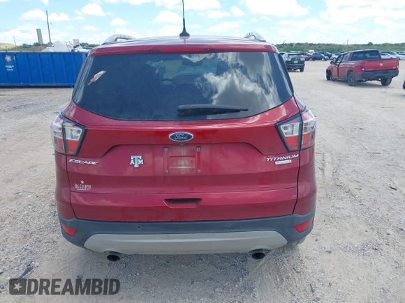 2018 Ford Escape Titanium with VIN 1FMCU0J96JUD58854, listed as a IAAI auction lot 42590609 with 77,825 mi miles and . Bid and sale history available at DreamBid. Image 16.