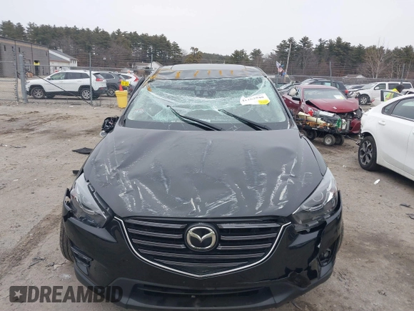 2016 Mazda CX-5 Grand Touring with VIN JM3KE4DY1G0685449, listed as a IAAI auction lot 41162840 with 134,525 mi miles. Bid and sale history available at carsss.com. Image 13.