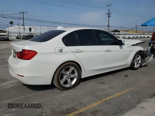 2015 BMW 3 Series 328i with VIN WBA3A5C56FF606517, listed as a Copart auction lot 59388115 with 185,684 mi miles and Salvage title. Bid and sale history available at DreamBid. Image 3.