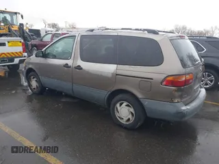 1999 Toyota Sienna LE with VIN 4T3ZF13C9XU164032, listed as a IAAI auction lot 41916673 with 296,628 mi miles and . Bid and sale history available at DreamBid. Image 3.