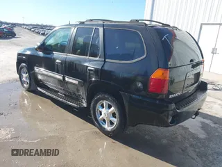 2005 GMC Envoy SLE z VIN 1GKDT13S952288760, wystawiony jako IAAI lot #41671656 z przebiegiem Nie podano mil oraz . Historia ofert i sprzedaży dostępna na DreamBid. Obrazek 3.