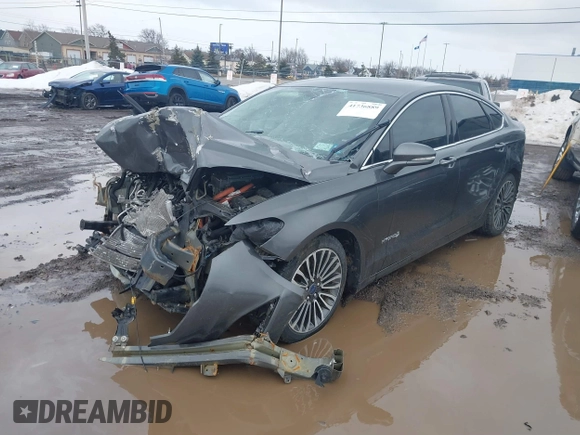 2017 Ford Fusion Hybrid Titanium z VIN 3FA6P0RU6HR279726, wystawiony jako IAAI lot #41736889 z przebiegiem 123 698 mil mil oraz . Historia ofert i sprzedaży dostępna na DreamBid. Obrazek 2.