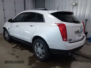 2014 Cadillac SRX Performance Collection with VIN 3GYFNFE36ES615440, listed as a IAAI auction lot 41830849 with 125,128 mi miles and . Bid and sale history available at DreamBid. Image 3.