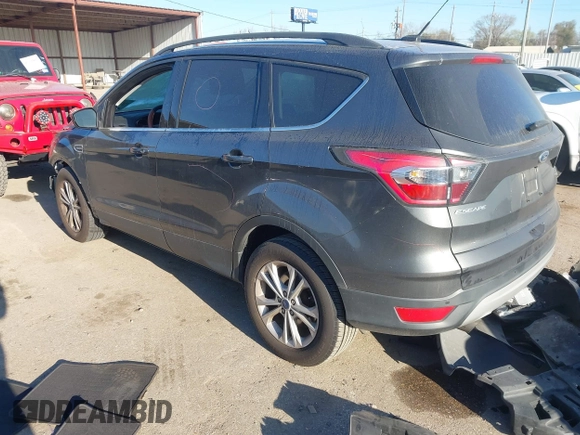 2017 Ford Escape SE z VIN 1FMCU0GD9HUB38906, wystawiony jako IAAI lot #41772488 z przebiegiem 108 259 mil mil oraz . Historia ofert i sprzedaży dostępna na DreamBid. Obrazek 3.