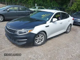 2018 Kia Optima LX with VIN 5XXGT4L36JG210914, listed as a IAAI auction lot 42545614 with 126,286 mi miles and . Bid and sale history available at DreamBid. Image 2.