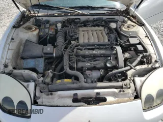 1996 Mitsubishi 3000GT GT z VIN JA3AM84J7TY005775, wystawiony jako Copart lot #70461554 z przebiegiem 102 704 mil mil oraz Tytuł czysty. Historia ofert i sprzedaży dostępna na DreamBid. Obrazek 11.