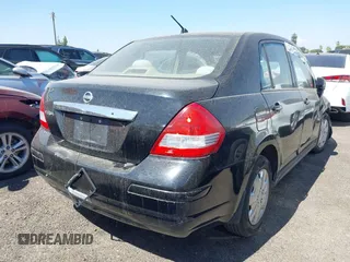 2009 Nissan Versa S with VIN 3N1BC11E19L440957, listed as a IAAI auction lot 40039437 with Not Provided miles and . Bid and sale history available at DreamBid. Image 4.