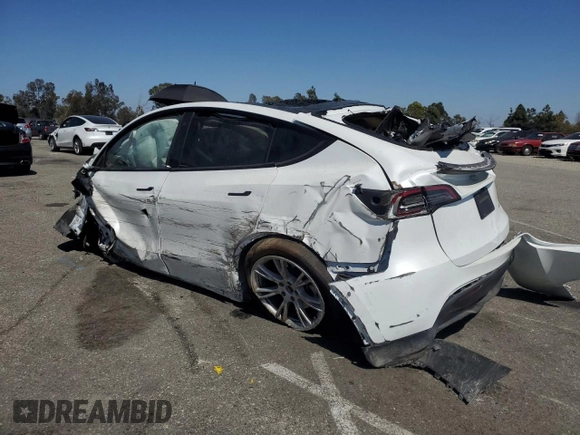 2023 Tesla Model Y Long Range z VIN 7SAYGDEE3PA077841, wystawiony jako Copart lot #54535215 z przebiegiem Nie podano mil oraz Szkoda całkowita • Salvage title. Historia ofert i sprzedaży dostępna na DreamBid. Obrazek 2.