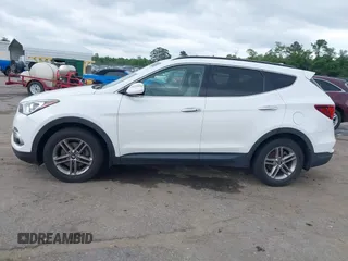 2018 Hyundai Santa Fe 2.4L z VIN 5XYZUDLB1JG543837, wystawiony jako IAAI lot #42235471 z przebiegiem 157 909 mil mil oraz . Historia ofert i sprzedaży dostępna na DreamBid. Obrazek 14.