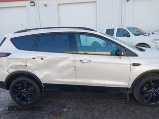2017 Ford Escape Titanium with VIN 1FMCU9J93HUE96611, listed as a IAAI auction lot 41546906 with 90,586 mi miles. Bid and sale history available at carsss.com. Image 13.