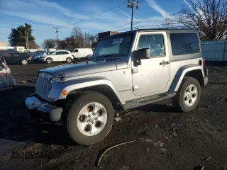 2015 Jeep Wrangler Altitude z VIN 1C4GJWBG7FL543278, wystawiony jako Copart lot #86794064 z przebiegiem 125 499 mil mil oraz Szkoda całkowita • Salvage title. Historia ofert i sprzedaży dostępna na DreamBid. Obrazek 1.