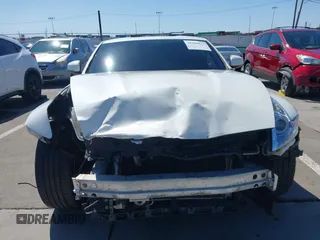 2009 Nissan 370Z Touring with VIN JN1AZ44E99M411252, listed as a IAAI auction lot 41969671 with 91,873 mi miles and . Bid and sale history available at DreamBid. Image 6.