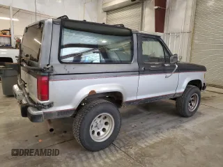 1988 Ford Bronco z VIN 1FMCU14T4JUA54161, wystawiony jako Copart lot #76312054 z przebiegiem 34 932 mil mil oraz Szkoda całkowita • Salvage title. Historia ofert i sprzedaży dostępna na DreamBid. Obrazek 3.