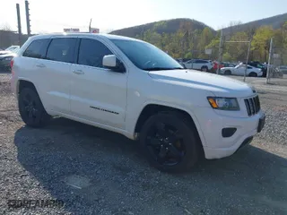 2015 Jeep Grand Cherokee Altitude with VIN 1C4RJFAG1FC797157, listed as a IAAI auction lot 42021139 with 148,491 mi miles. Bid and sale history available at carsss.com. Image 1.