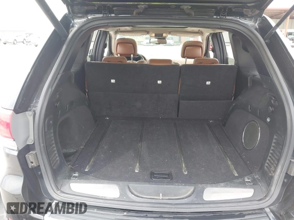 2015 Jeep Grand Cherokee Summit z VIN 1C4RJFJT0FC674494, wystawiony jako IAAI lot #42056835 z przebiegiem 143 969 mil mil oraz . Historia ofert i sprzedaży dostępna na DreamBid. Obrazek 18.