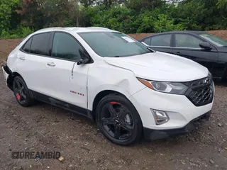 2021 Chevrolet Equinox Premier z VIN 2GNAXNEV0M6128650, wystawiony jako IAAI lot #42361738 z przebiegiem 21 246 mil mil oraz . Historia ofert i sprzedaży dostępna na DreamBid. Obrazek 1.