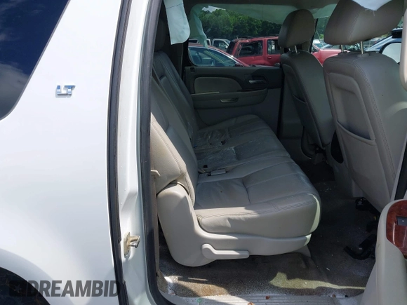 2014 Chevrolet Suburban LT with VIN 1GNSCJE07ER211222, listed as a IAAI auction lot 42428084 with 214,712 mi miles and . Bid and sale history available at DreamBid. Image 8.