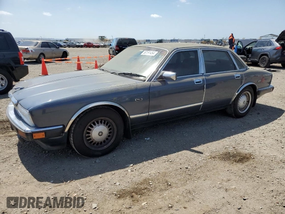 1992 Jaguar XJ with VIN SAJHY174XNC649368, listed as a Copart auction lot 50191454 with 99,553 mi miles and Salvage Title. Bid and sale history available at DreamBid. Image 1.